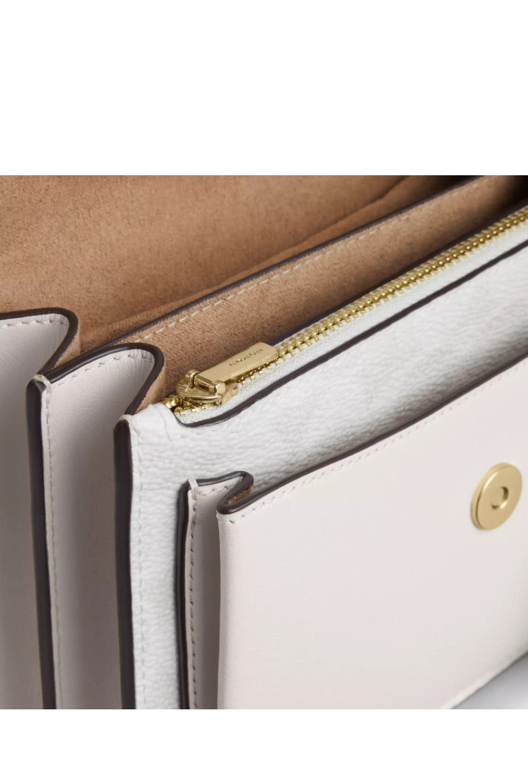 Mini Klare Crossbody Bag in Signature Canvas Gold White Chalk