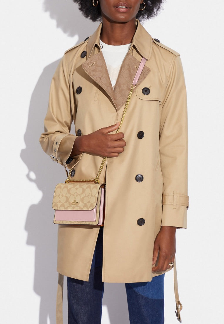 Mini Klare Crossbody In Signature Canvas Powder Pink