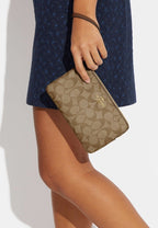 Large Corner Zip Wristlet In Signature Canvas Khaki Saddle