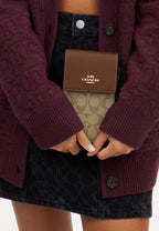 North South Phone Crossbody In Signature Canvas Khaki Saddle 2