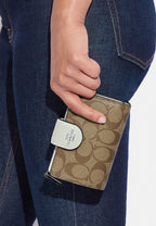 Medium Corner Zip Wallet In Signature Canvas Light Sage