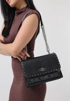 Klare Crossbody In Signature Canvas With Rivets Graphite Black