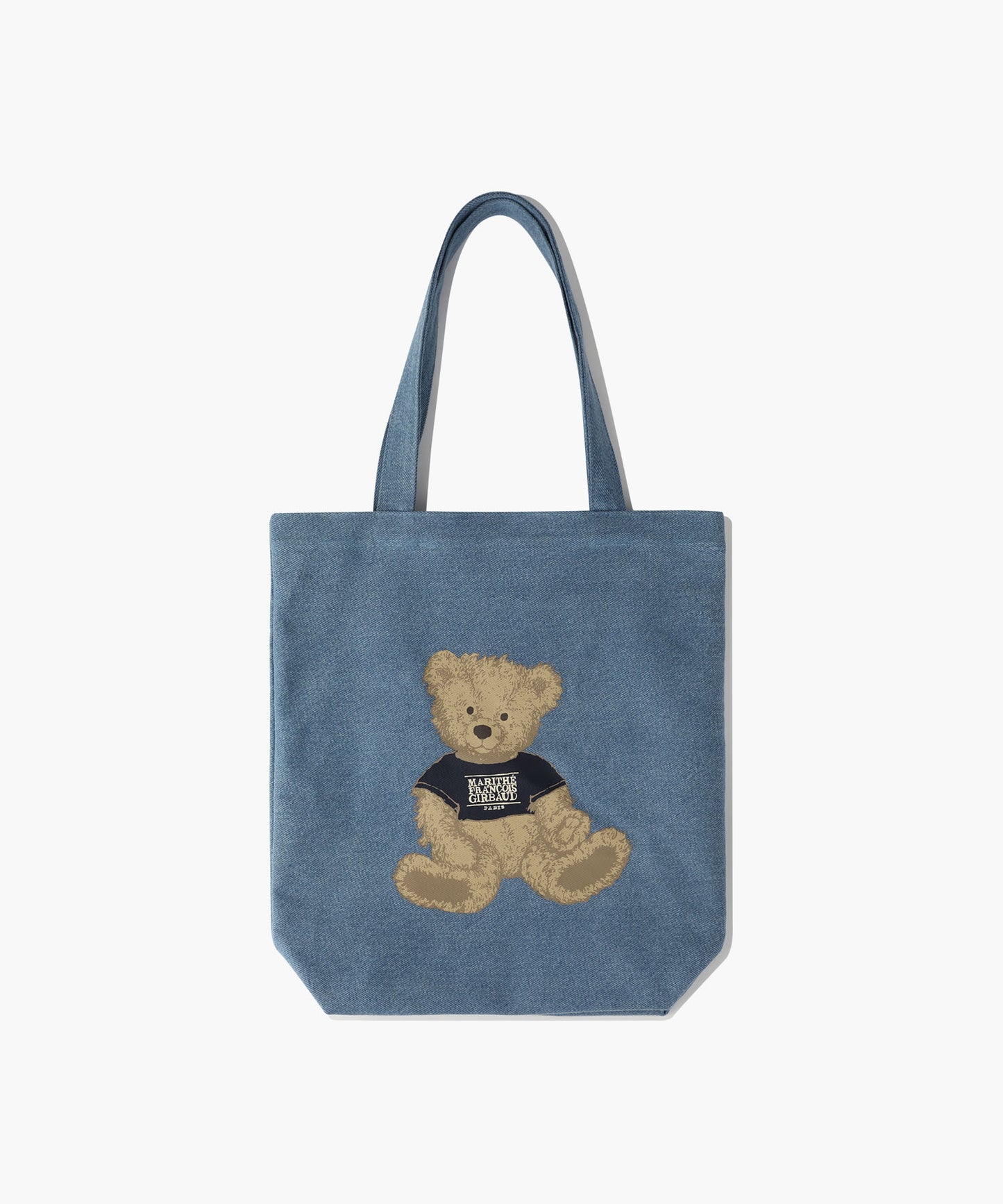 Marithe Francois Girbaud denim coloured canvas tote bag with a teddy bear design in doodle style on a white background