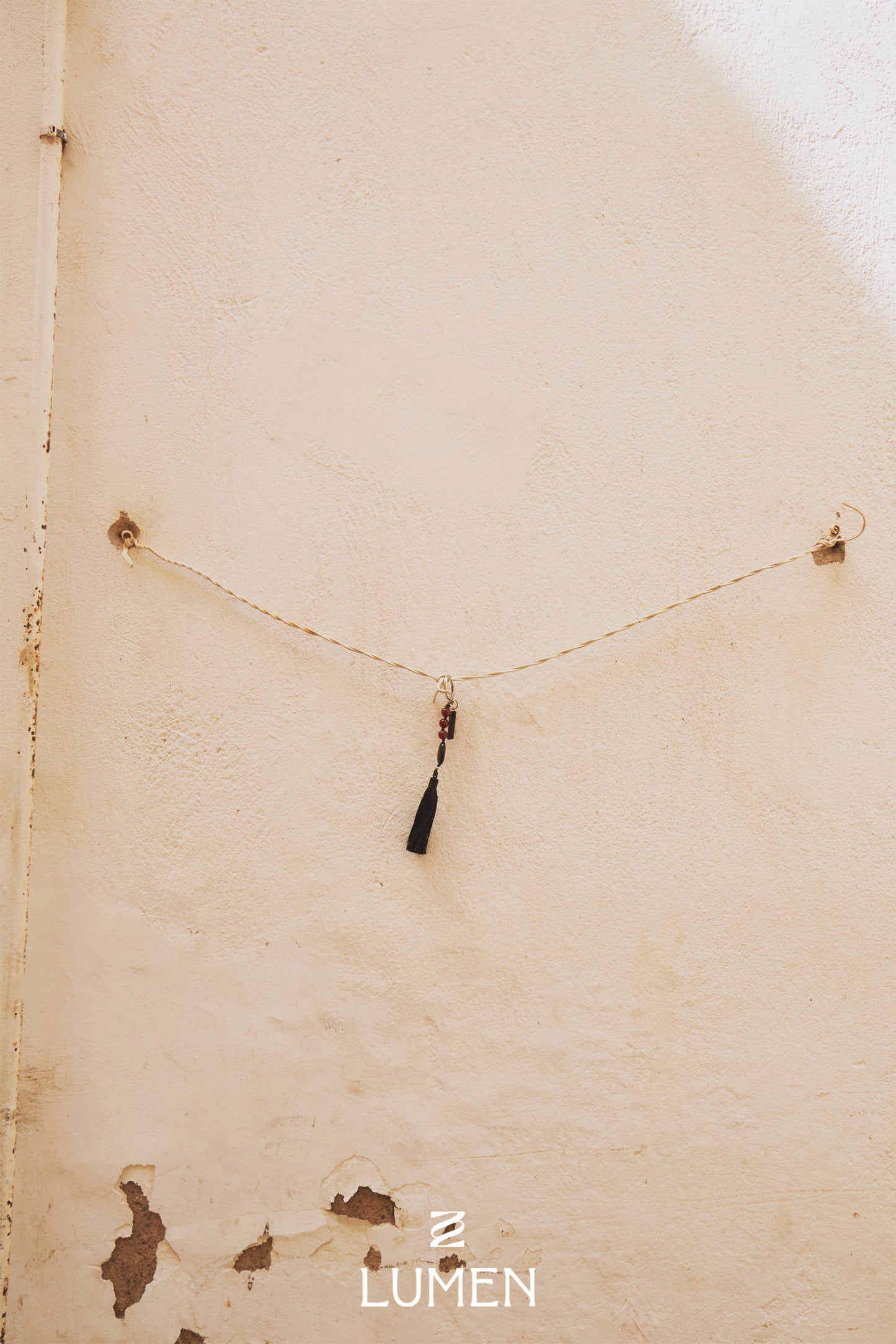 TASSEL CHARM soft black
