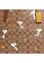 Coach X Peanuts City Tote In Signature Canvas With Snoopy Woodstock Print Redwood Multi