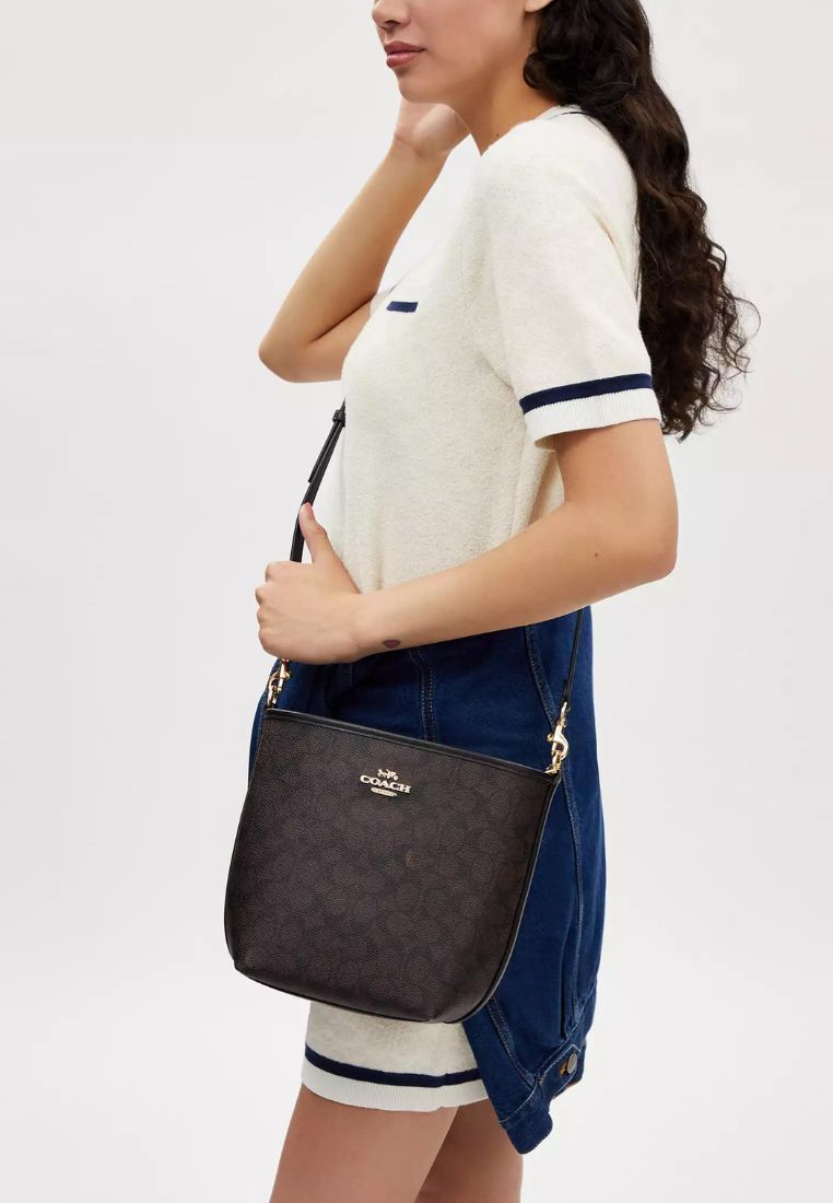 City Bucket Bag In Signature Canvas Walnut Black