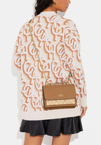 Klare Crossbody Bag In Signature Canvas Lt Saddle