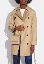 Mini Klare Crossbody In Signature Canvas Powder Pink